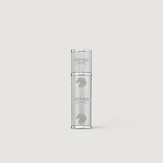 Creed silver leather 5ml perfume atomizer on a light gray background