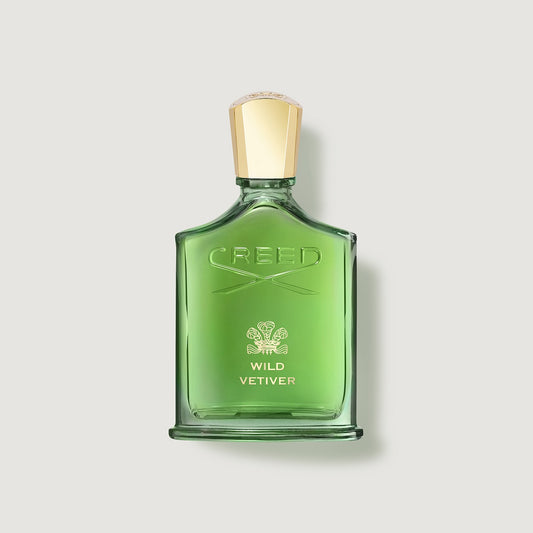 Wild Vetiver Green Creed Wild Vetiver perfume bottle on a light gray background
