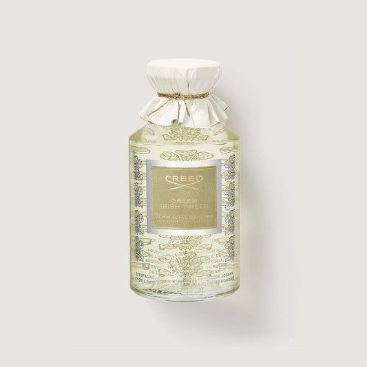 Creed Green Irish Tweed perfume bottle on a light gray background